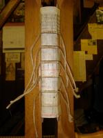 The spine lined with vellum between the bands.