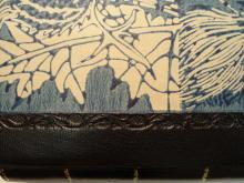 Quarter leather binding, morocco spine with block printed paste paper sides.