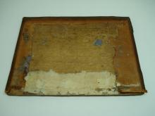 Original wooden board with remaining brass fittings.