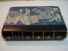 Quarter leather binding, morocco spine with block printed paste paper sides.
